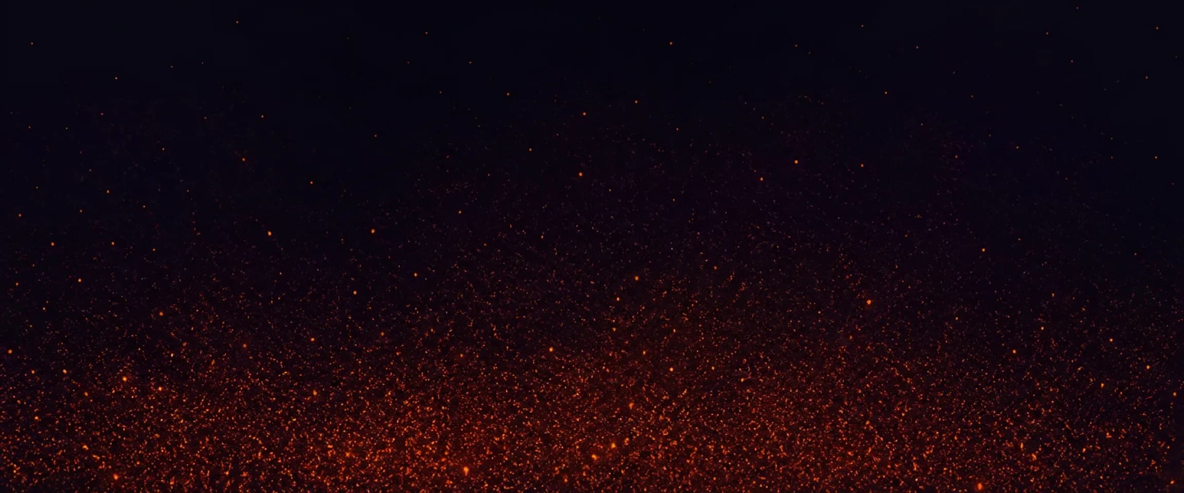 Thousands of tiny warm ember particles settle along a calm dark band